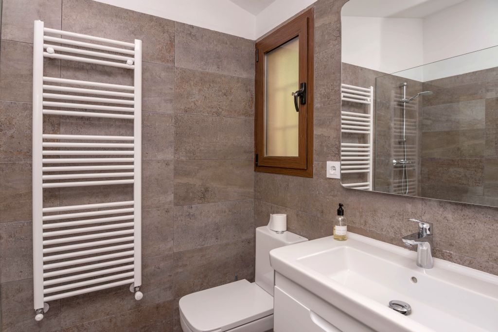 The bathroom is entirely new and contains an Italian shower, toilet and wash-basin.