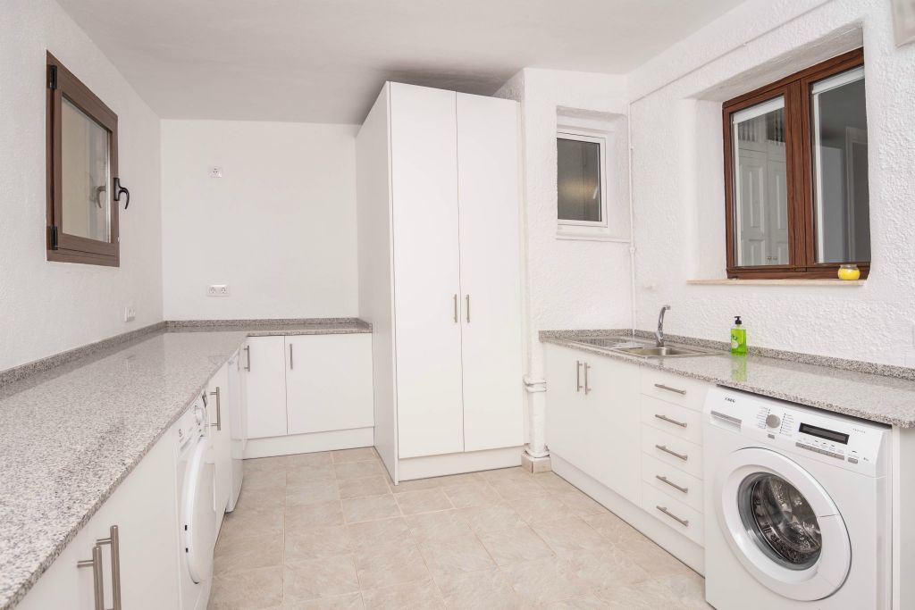The pantry contains an additional fridge, a washing machine, a tumble dryer and all extra equipment. Groceries can easily be carried from the car to the pantry by a direct access from the parking spot.