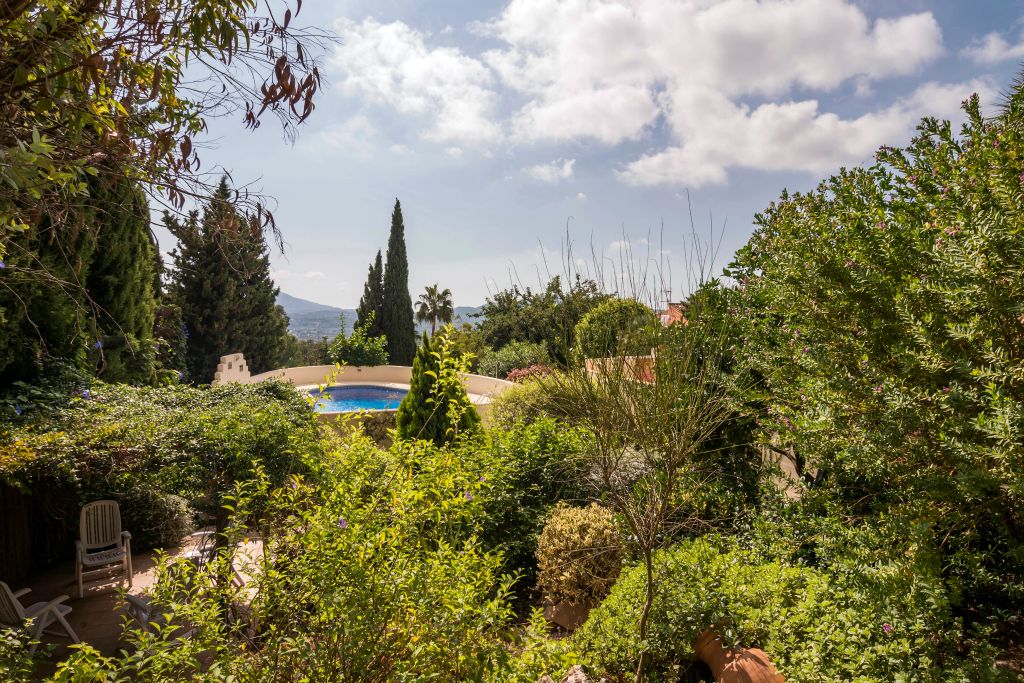 A professional gardener takes care of the garden twice a month.
